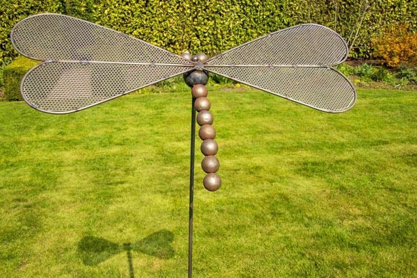 bare metal steel dragonfly sculpture