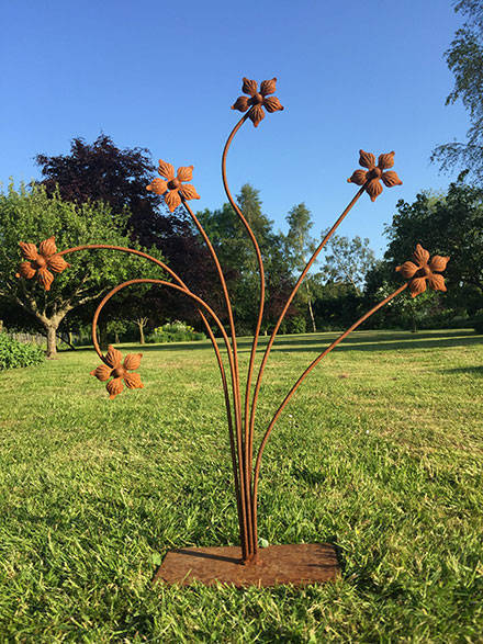multi headed flower sculpture in bare steel finish